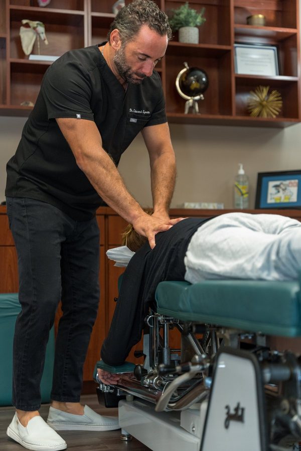 Dr. Esposito treating a patient on the Cox Flexion-Distraction table.