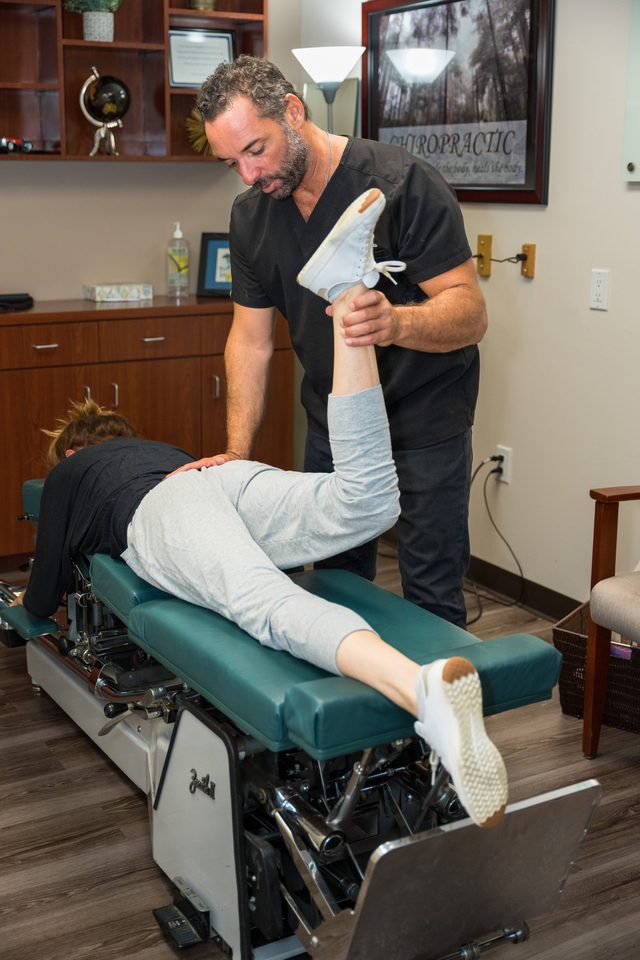 Dr. Esposito treating a patient on the Cox Flexion-Distraction table.